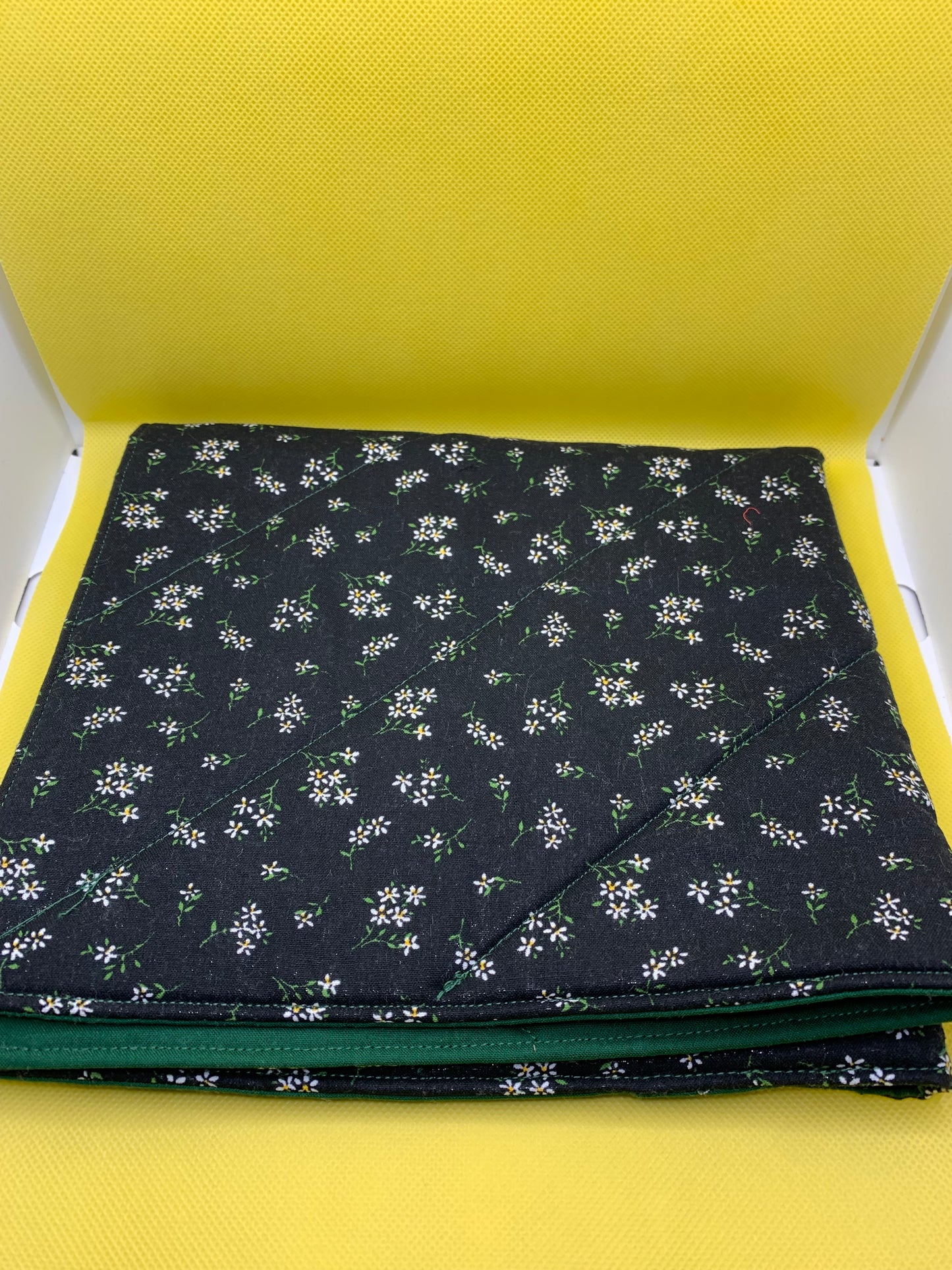 LW Designs quilted oversized hot pads and trivets with a padded, quilted design for heat protection and decorative kitchen use.