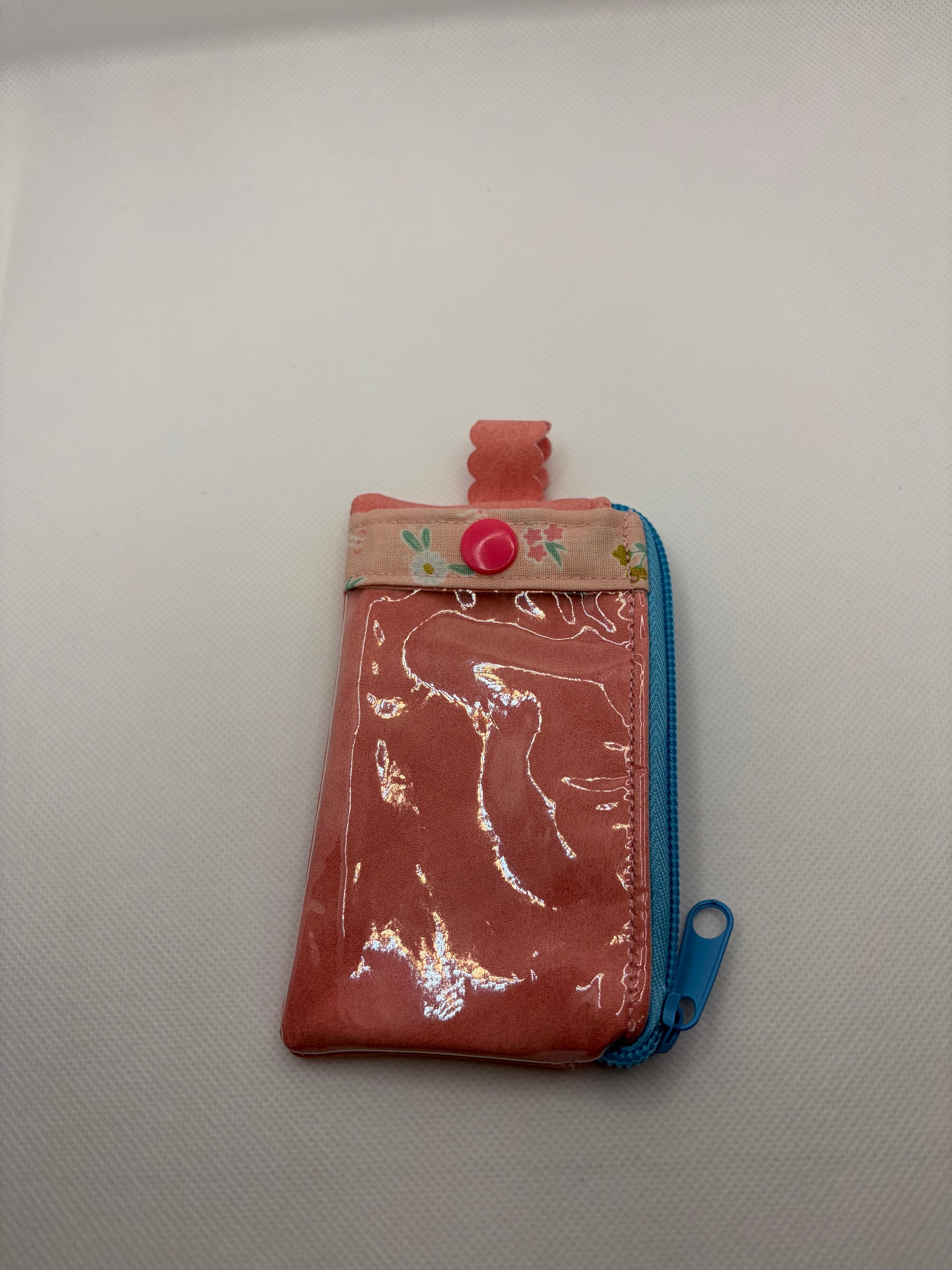 Black leather wallet with multiple card slots from LW Designs, displayed open showing organization of cards inside.
