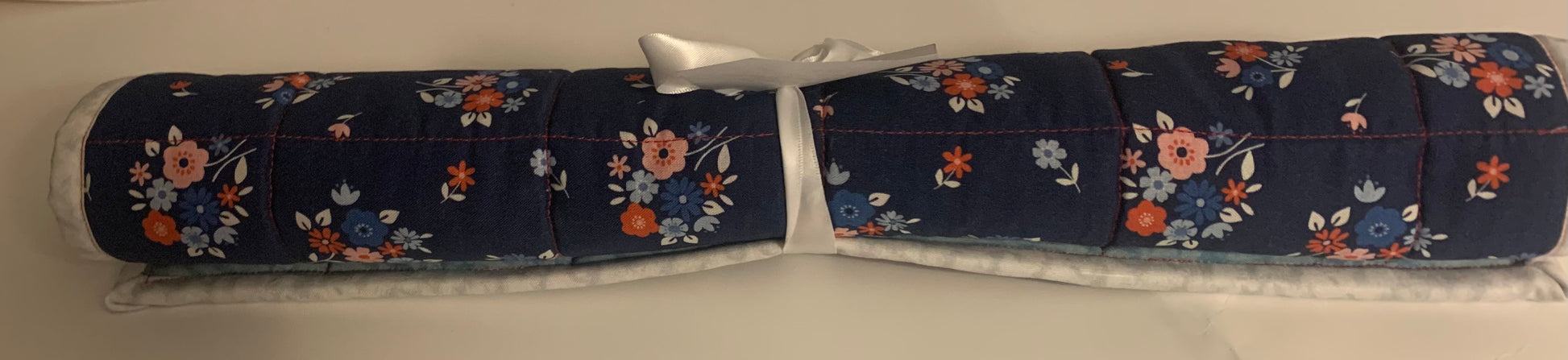 Lavender quilted oversized hot pads or trivets with stitched design, made by LW Designs, for protecting surfaces from hot cookware.