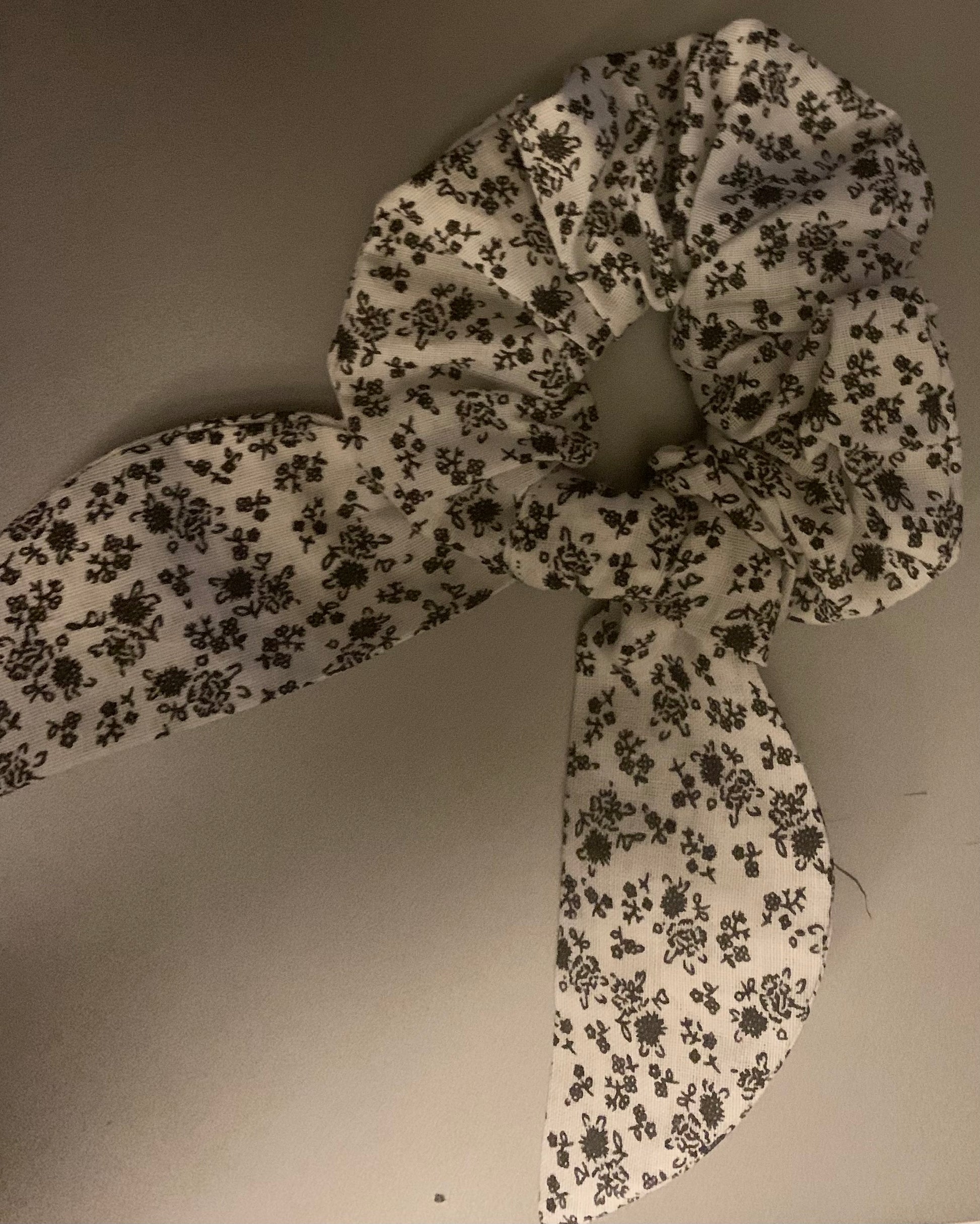 LW Designs hair scrunchies in various colors, soft fabric, and elastic for gentle hair hold and styling.