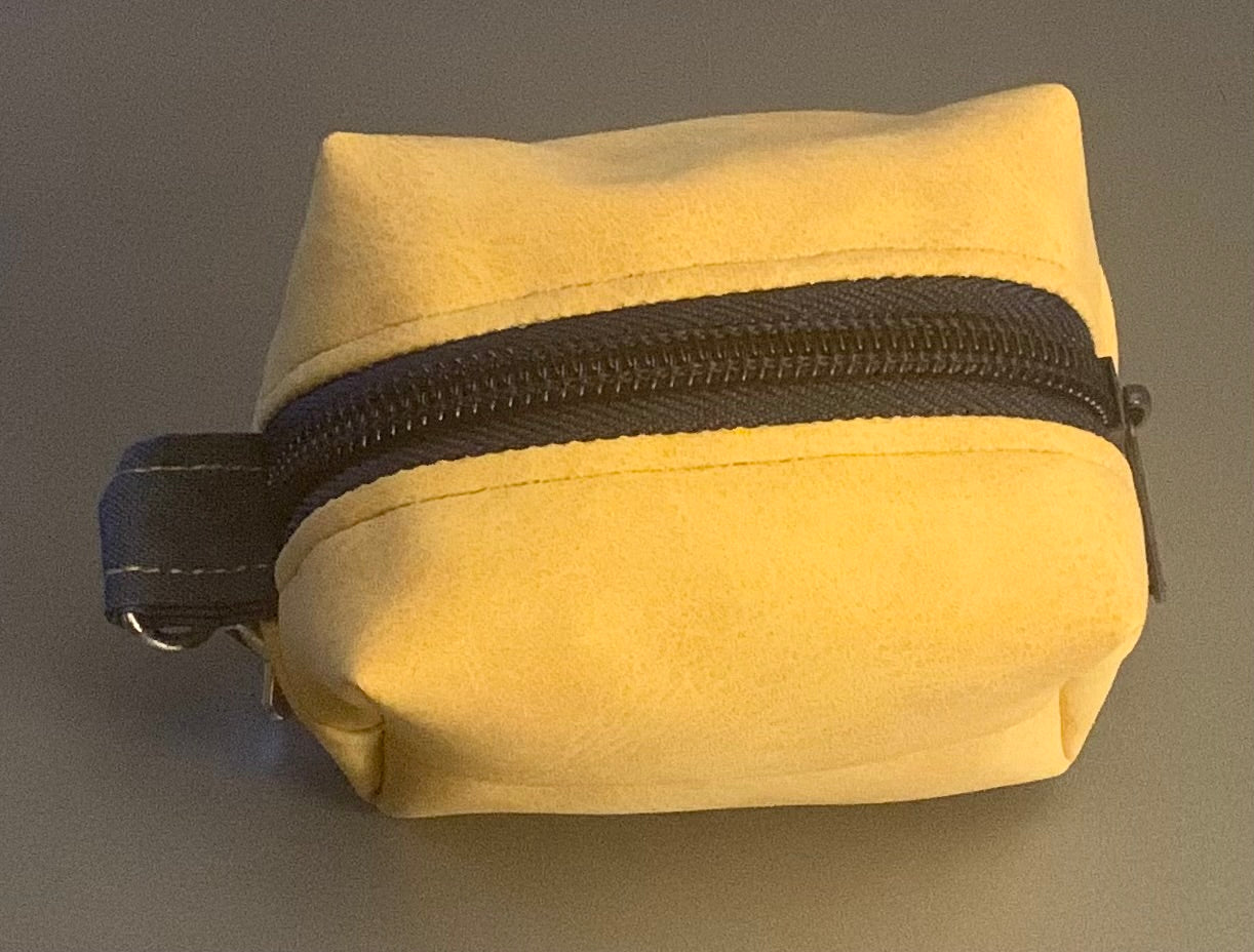 LW Designs poop bag holder with clip and zipper closure, compact and portable for easy pet waste disposal.