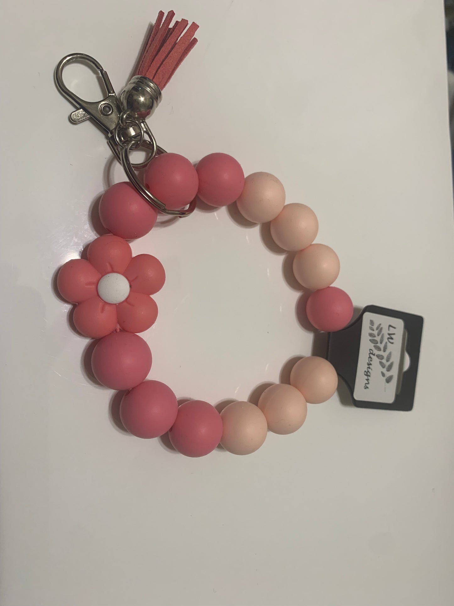 Beaded wristlet keychain by LW Designs featuring colorful beads and a looped strap for easy carrying and decoration.