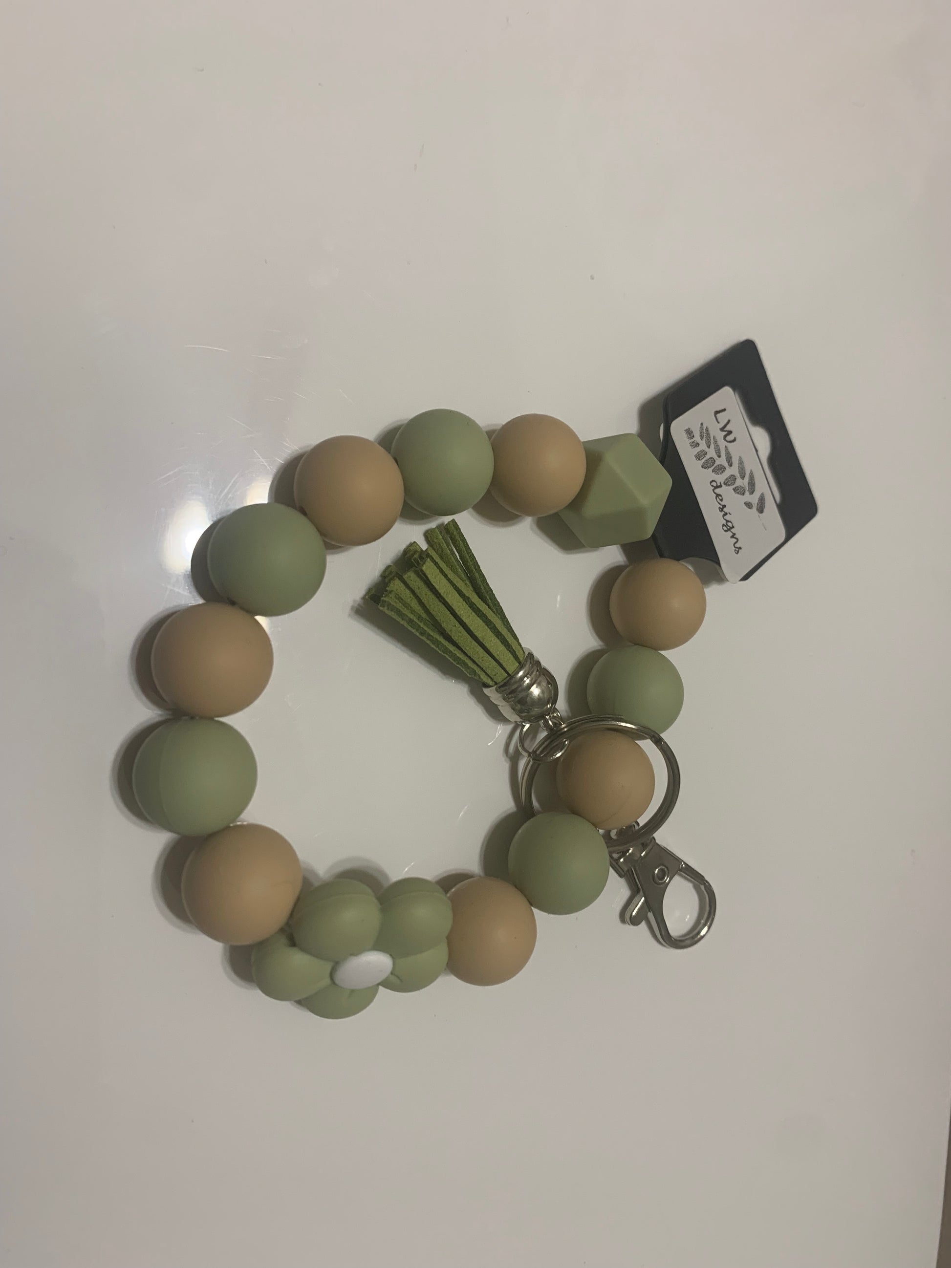 Beaded wristlet keychain by LW Designs featuring colorful beads and a loop for easy carrying or attaching to bags.