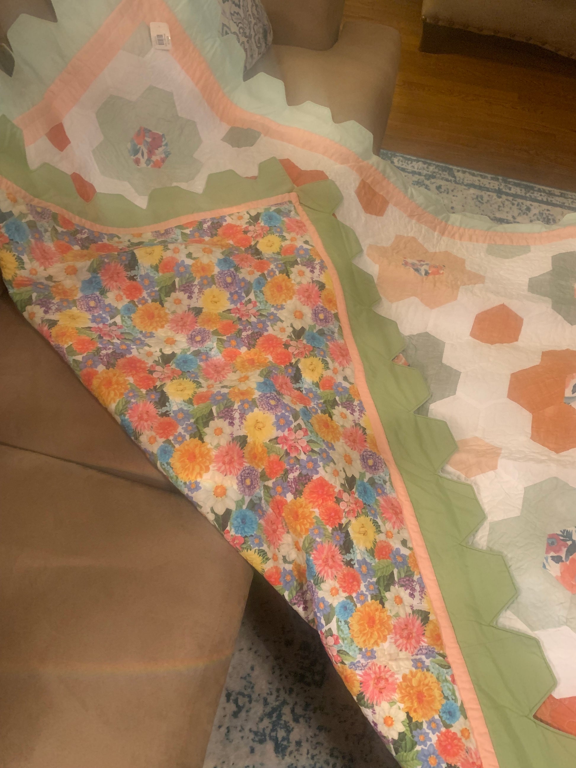 Hexagon flower quilt in throw size by LW Designs, featuring colorful hexagon patterns and intricate floral stitching.