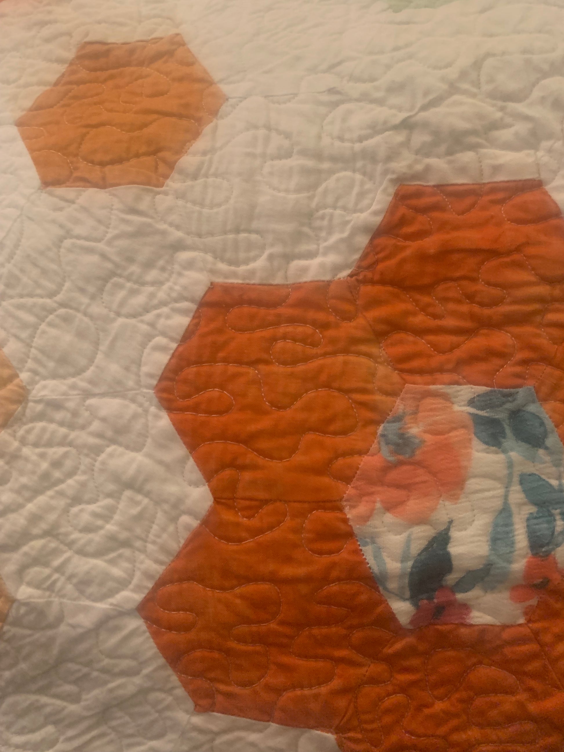 Light blue throw size hexagon flower quilt by LW Designs, featuring a floral pattern and cozy fabric for bedroom decor.