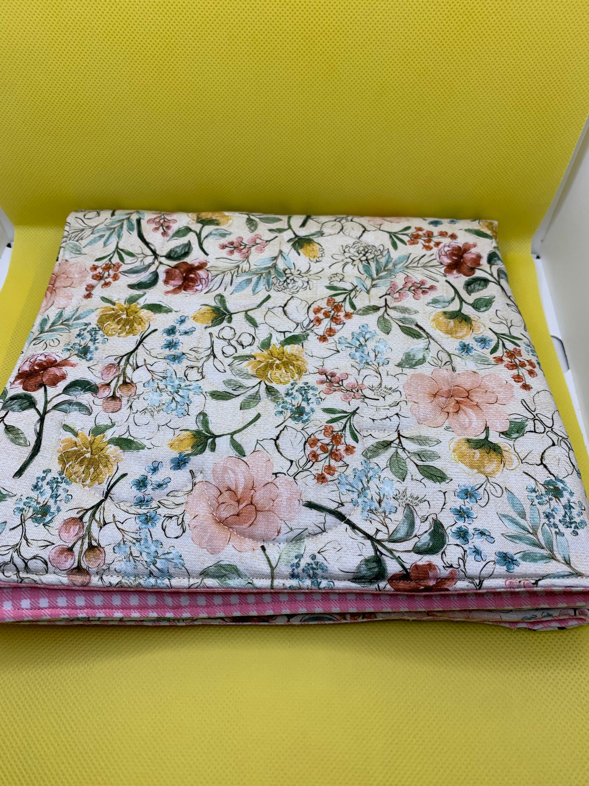 LW Designs quilted oversized hot pads and trivets with padded, quilted fabric for heat protection and decorative kitchen use.