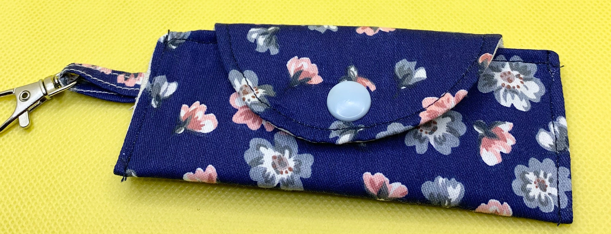 LW Designs lip balm holder with clip, compact and portable accessory for carrying chapstick securely.