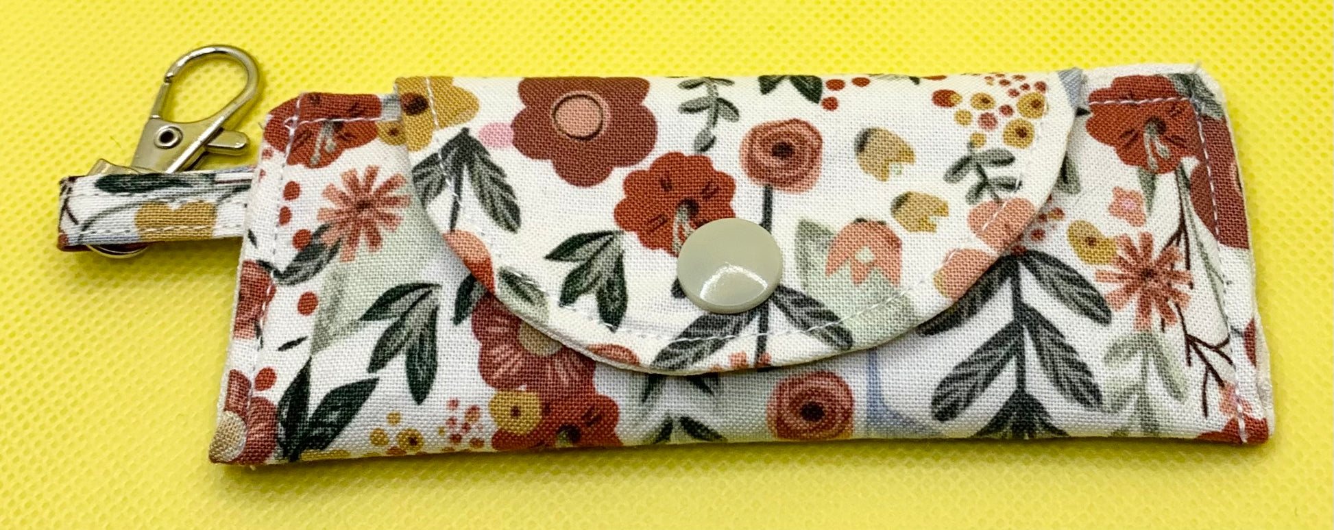 LW Designs lip balm holder with keychain attachment, compact and stylish accessory for carrying chapstick conveniently.
